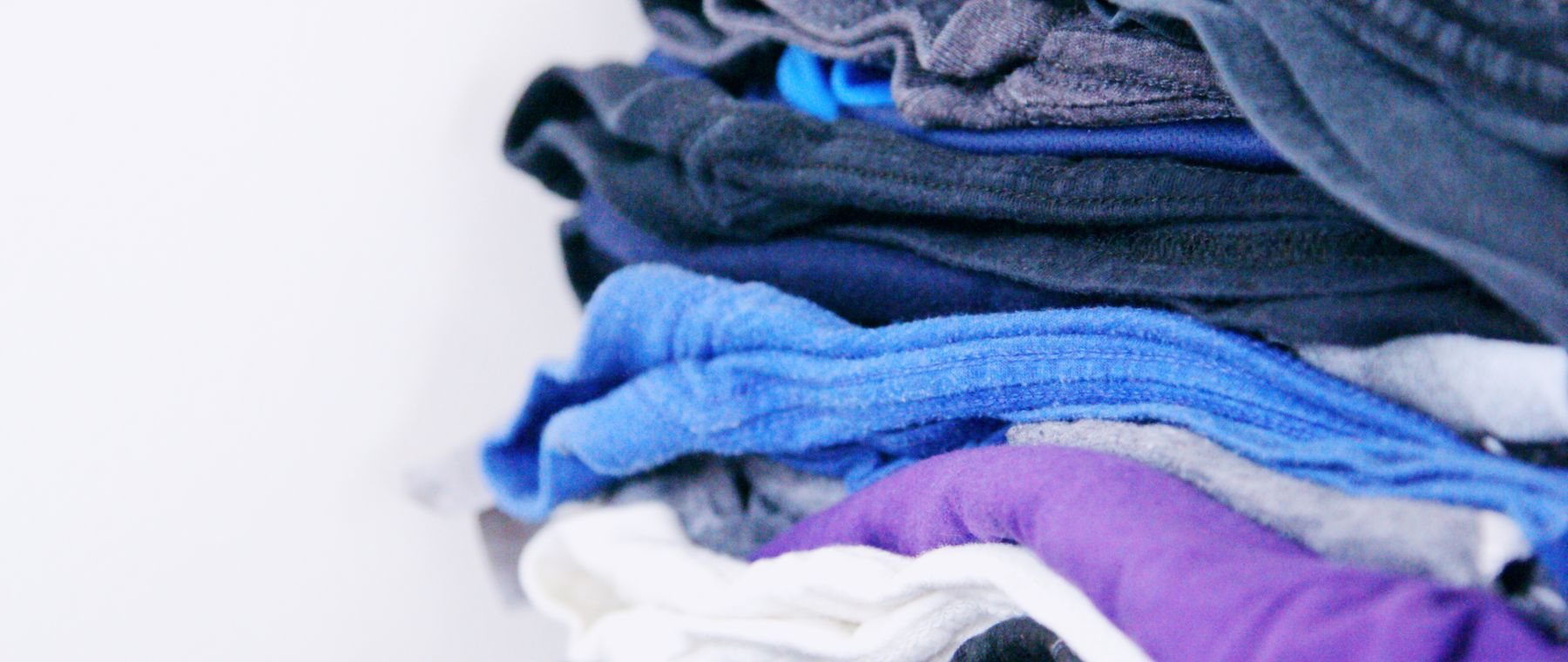 Stacks of freshly laundered, neatly folded clothes